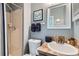 This bathroom has a shower, toilet, vanity with a mirror, and tile accents at 18843 E Colorado Dr, Aurora, CO 80017