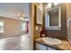 Bathroom featuring a granite countertop with a decorative sink and fixtures at 18843 E Colorado Dr, Aurora, CO 80017