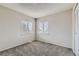 This bedroom is bright and has carpeted floors and a large window at 18843 E Colorado Dr, Aurora, CO 80017