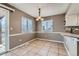 Dining area with neutral walls, tile flooring, and a sliding door to the patio at 18843 E Colorado Dr, Aurora, CO 80017