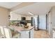 Kitchen with stainless steel appliances, tiled countertops, and a breakfast bar at 18843 E Colorado Dr, Aurora, CO 80017