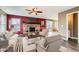 This living room features a brick fireplace, hardwood floors, and modern furniture at 18843 E Colorado Dr, Aurora, CO 80017