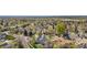 Panoramic aerial view of the property and surrounding neighborhood with trees and roadways at 3055 E 133Rd Cir, Thornton, CO 80241