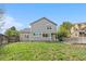 Backyard view of the home features a fenced in yard and grass at 3055 E 133Rd Cir, Thornton, CO 80241