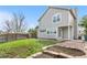 Backyard view of the home with green grass and fenced in yard at 3055 E 133Rd Cir, Thornton, CO 80241