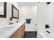 Beautiful bathroom with modern vanity, black accents, subway tile shower and black tile floor at 3055 E 133Rd Cir, Thornton, CO 80241