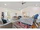 Bright, spacious bedroom features an ensuite bathroom and a cozy seating area at 3055 E 133Rd Cir, Thornton, CO 80241