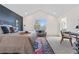 Bright and spacious bedroom with a view, reading nook, and a connected bath at 3055 E 133Rd Cir, Thornton, CO 80241