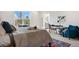 Bright bedroom featuring a reading nook and an ensuite bathroom at 3055 E 133Rd Cir, Thornton, CO 80241