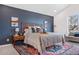 Inviting bedroom with modern decor, a large window and a calming color palette at 3055 E 133Rd Cir, Thornton, CO 80241