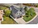 Aerial view of a well-maintained home showcasing a two-car garage and landscaped yard at 3055 E 133Rd Cir, Thornton, CO 80241