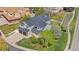 Aerial view of home with well manicured front lawn, two-car garage and front porch at 3055 E 133Rd Cir, Thornton, CO 80241