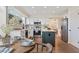 Spacious kitchen with stainless steel appliances, island, and breakfast table at 3055 E 133Rd Cir, Thornton, CO 80241