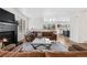 Cozy living room with a fireplace, comfortable seating, and an open view into the updated kitchen at 3055 E 133Rd Cir, Thornton, CO 80241