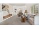 Inviting living room showcasing an open layout, a staircase, and views into the adjacent dining area at 3055 E 133Rd Cir, Thornton, CO 80241