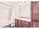 Bathroom with a combined shower and tub, vanity with sink, and a large mirror at 10111 Inverness Main St # 228, Englewood, CO 80112