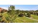 Scenic view of a lush green golf course surrounded by mature trees at 10111 Inverness Main St # 228, Englewood, CO 80112