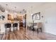 Cozy kitchen featuring wood cabinets, stainless steel appliances, and a dining table at 10111 Inverness Main St # 228, Englewood, CO 80112