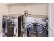 Convenient laundry room with a modern washer and dryer set for easy laundry at 10111 Inverness Main St # 228, Englewood, CO 80112