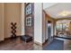 A modern lobby with tile flooring, art accents and a view of the pool through glass doors at 10111 Inverness Main St # 228, Englewood, CO 80112