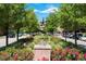 Street view featuring a public art piece and tree-lined streets, creating a welcoming atmosphere at 10111 Inverness Main St # 228, Englewood, CO 80112