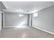 Finished basement featuring neutral carpet, white trim and paint, and a window at 2921 E Colorado Ave, Denver, CO 80210