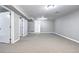 Finished basement featuring neutral carpet and multiple white doors at 2921 E Colorado Ave, Denver, CO 80210