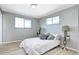 Bright bedroom with light wood floors, stylish bedside tables, and light gray walls at 2921 E Colorado Ave, Denver, CO 80210