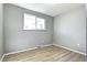 Bedroom featuring light wood floors, a window, and light gray walls at 2921 E Colorado Ave, Denver, CO 80210