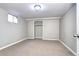 Neutral bedroom offers a built-in closet, neutral carpet, and a single window at 2921 E Colorado Ave, Denver, CO 80210