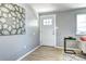 Bright entryway showcases stylish flooring, fresh paint, and a welcoming front door at 2921 E Colorado Ave, Denver, CO 80210