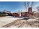 The exterior of the home has a brick exterior and a white door at 2921 E Colorado Ave, Denver, CO 80210