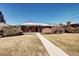 Charming single-story brick home featuring a well-maintained lawn and inviting walkway at 2921 E Colorado Ave, Denver, CO 80210