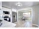 Modern kitchen featuring stainless steel appliances, white cabinets, and hardwood floors at 2921 E Colorado Ave, Denver, CO 80210