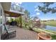 Outdoor patio with outdoor seating, barbecue, and pond view at 7888 Canvasback Cir, Littleton, CO 80125