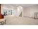 Spacious carpeted basement with stairs and an exercise area at 7888 Canvasback Cir, Littleton, CO 80125