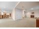 Finished basement featuring beige carpet and wet bar at 7888 Canvasback Cir, Littleton, CO 80125