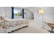Bedroom featuring large window with view and neutral decor at 7888 Canvasback Cir, Littleton, CO 80125