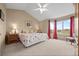 Bright Primary bedroom with a vaulted ceiling and large windows offering natural light and views at 7888 Canvasback Cir, Littleton, CO 80125