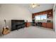 Versatile bonus room with high ceilings, built-in shelves, and ample workspace at 7888 Canvasback Cir, Littleton, CO 80125