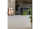 Bonus room with a guitar and piano on a light-colored carpet, providing a creative space at 7888 Canvasback Cir, Littleton, CO 80125