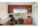 Bonus room with built-in shelves surrounding a bright window, offering scenic views at 7888 Canvasback Cir, Littleton, CO 80125