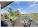 Outdoor deck featuring seating and a table, with a beautiful view of the lake and surrounding landscape at 7888 Canvasback Cir, Littleton, CO 80125