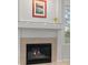 Close-up of a modern fireplace with tile surround at 7888 Canvasback Cir, Littleton, CO 80125