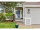 Close-up of front entrance with decorative shrubbery and a clear view of the house number at 7888 Canvasback Cir, Littleton, CO 80125