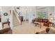 Spacious living room with high ceilings, neutral decor, and a staircase at 7888 Canvasback Cir, Littleton, CO 80125