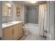Stylish bathroom with modern fixtures, a bathtub with shower, and a unique patterned tile floor at 8140 S Storm King Peak, Littleton, CO 80127