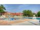 Large community pool and clubhouse with ample seating, ideal for summer relaxation and socializing at 8140 S Storm King Peak, Littleton, CO 80127