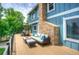 Spacious deck area with comfortable seating, overlooking the backyard at 8140 S Storm King Peak, Littleton, CO 80127