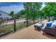 Scenic deck with views of lush greenery and comfortable outdoor seating at 8140 S Storm King Peak, Littleton, CO 80127
